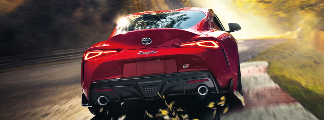 2025 Toyota GR Supra driving down a street