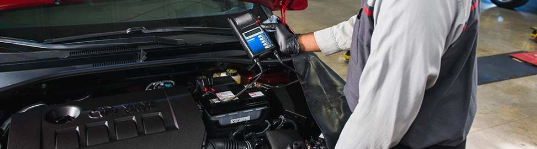 A technician working on a battery
