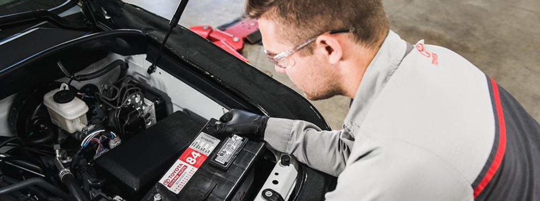A technician replacing a battery